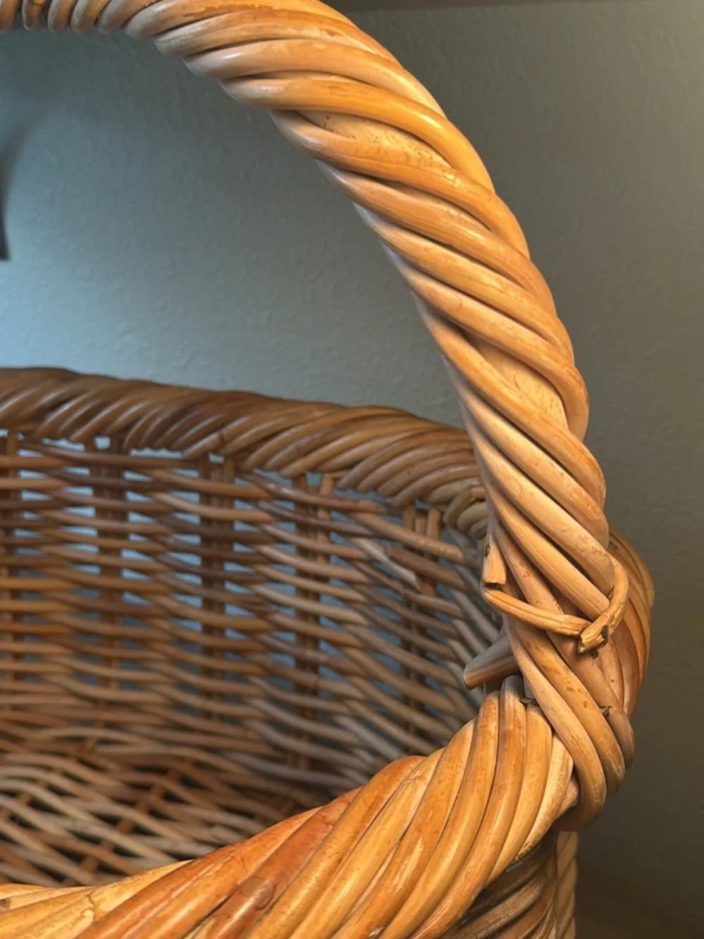 Woven Wicker Basket with Pink Crochet Throw